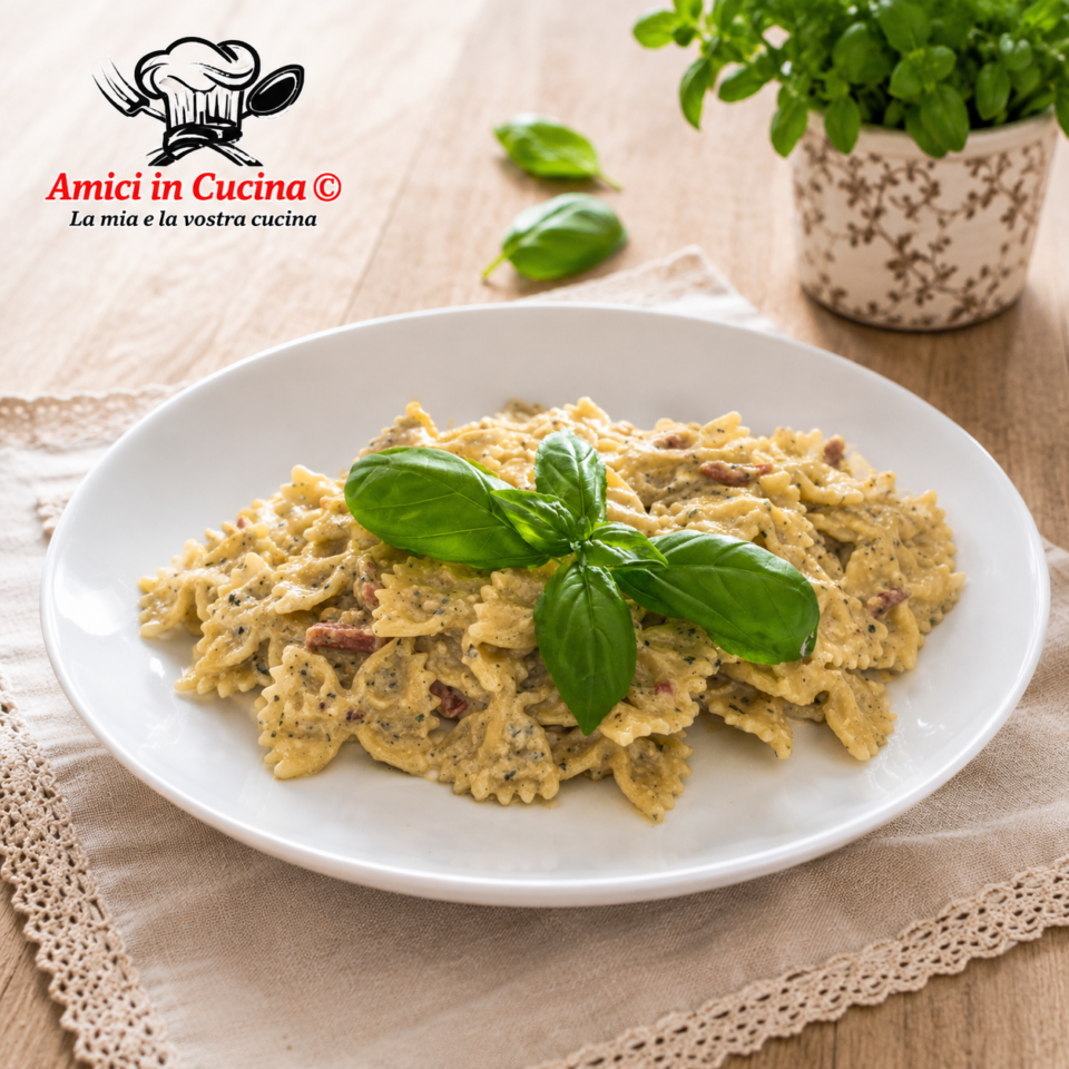 Farfalle con crema di zucchine noci e speck