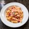 Fusilli "a modo mio": cremosissimi con Philadelphia, pomodoro e prosciutto crudo