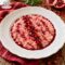 Risotto al melograno con guanciale: l'eleganza dell'autunno nel piatto