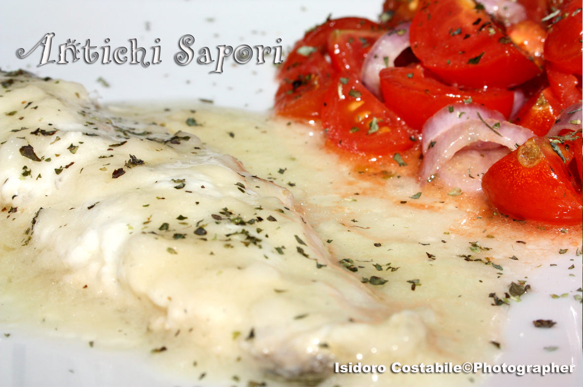 Spigola affogata al vino bianco.