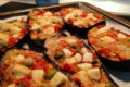 Melanzane a barchetta al forno con pomodorini e provola affumicata