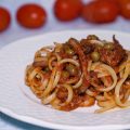 Linguine con polpo, pomodorini e piselli