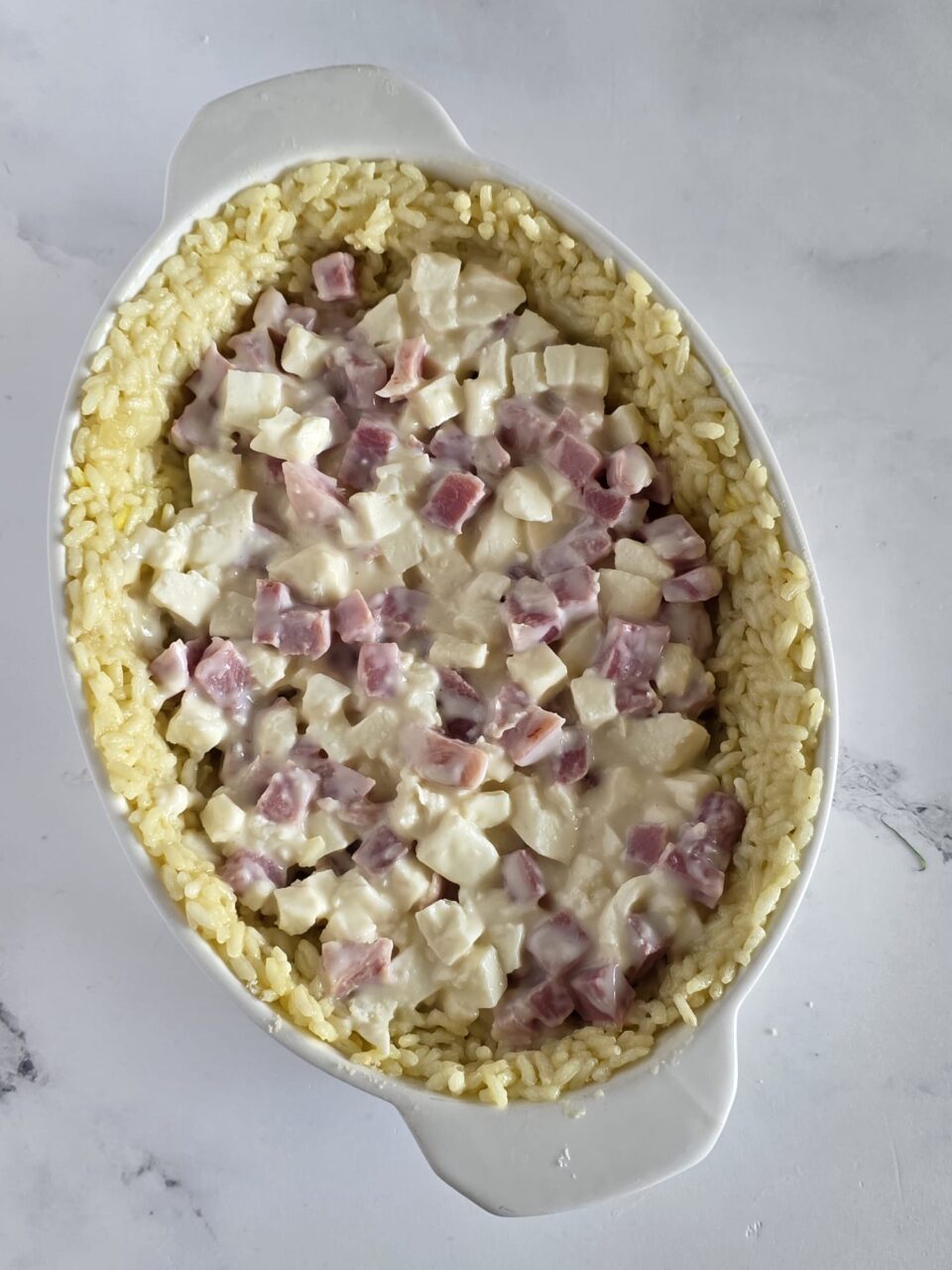 Sformato di riso al forno con prosciutto e mozzarella