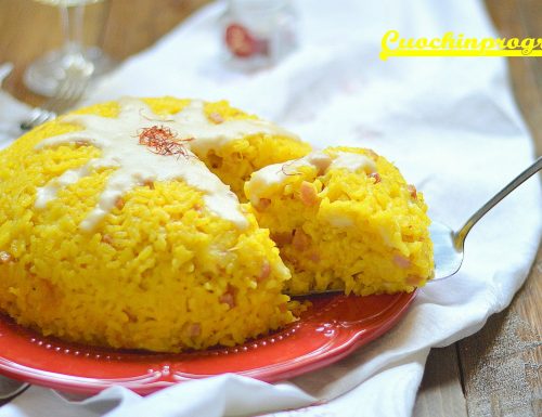 Timballo di riso giallo con formaggi e prosciutto