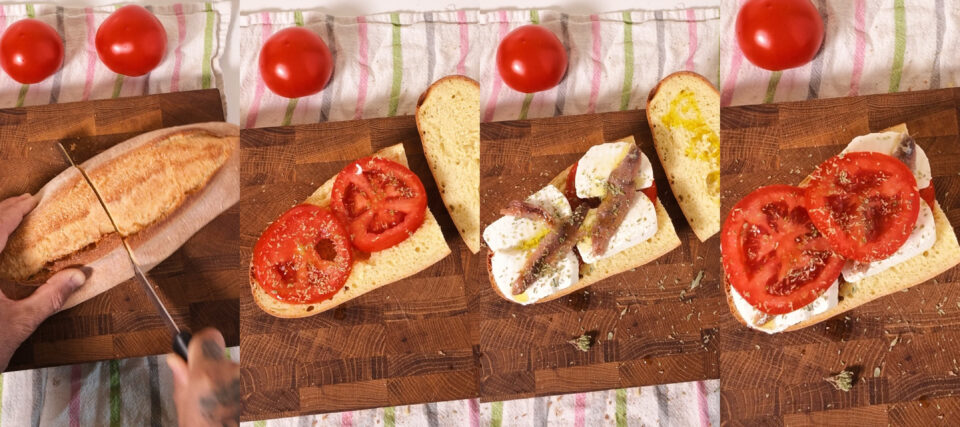 Pane cunzato palermitano con pomodoro, primosale e acciughe.