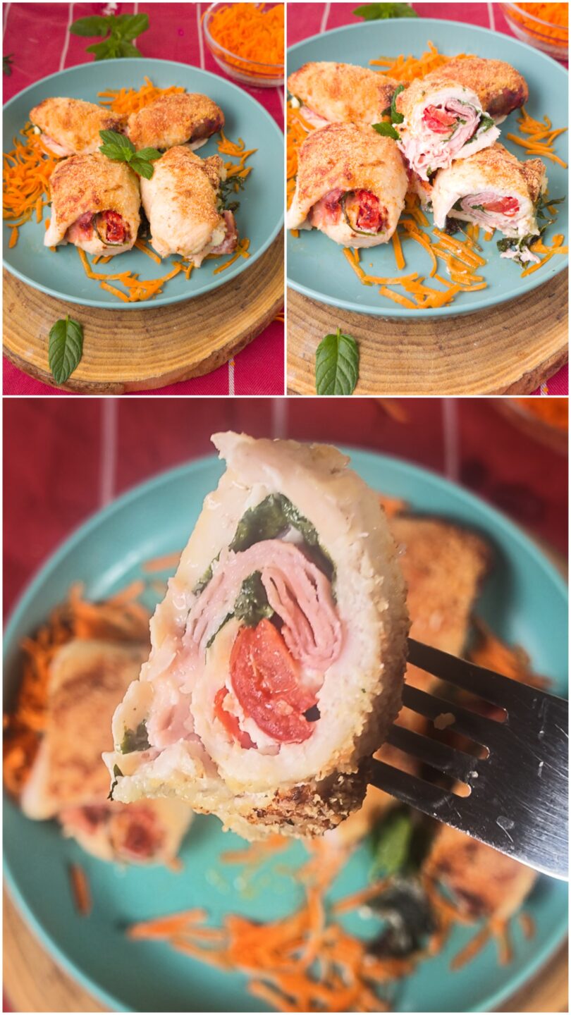 ): Un'immagine orizzontale e invitante di una ciotola blu acqua con involtini di pollo arrosto, serviti su un letto di carote grattugiate e un tagliere di legno rotondo. Ci sono ciotole di menta fresca, carote grattugiate e pomodori freschi sullo sfondo, con posate di bronzo su un tovagliolo ocra in primo piano.