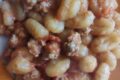 Gnocchi con pomodori pelati e salsiccia