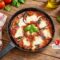 Melanzane al sugo in padella con provola filante