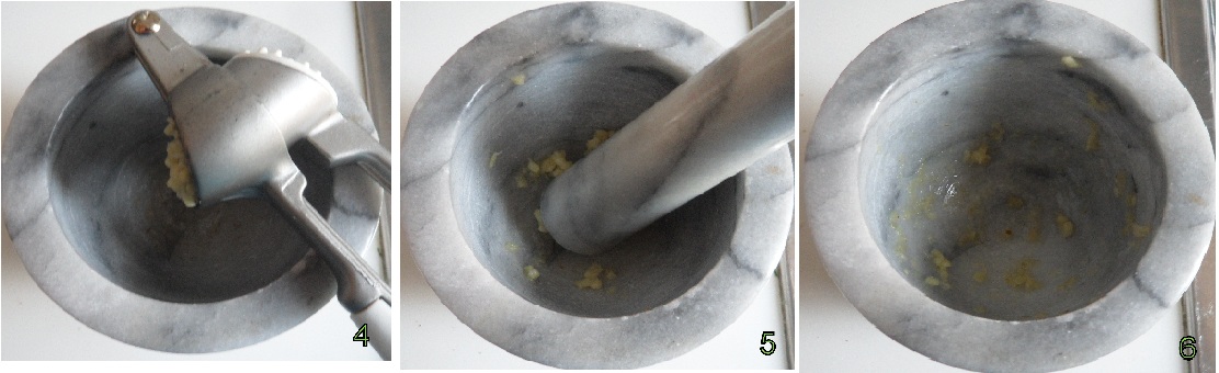 Pestare l'aglio per preparare lo tzatziki secondo la ricetta originale greca