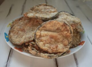 Preparazione parmigiana di melanzane fritte
