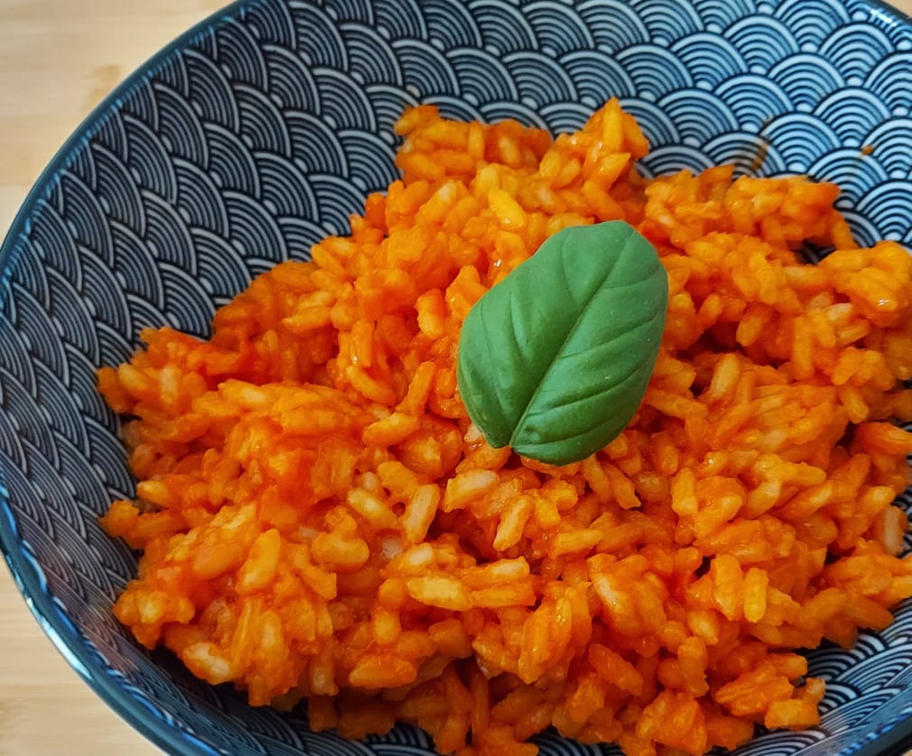 Risotto con fiocchi di latte e concentrato di pomodoro