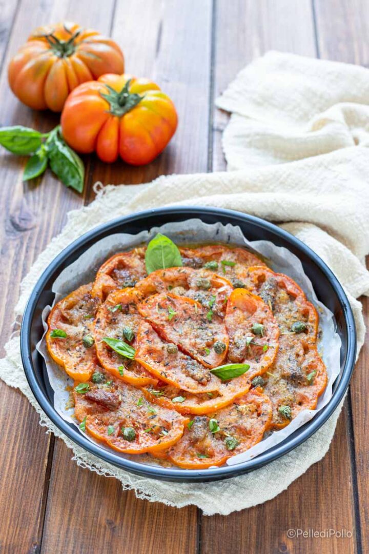 pomodori gratinati con erbe, alici e capperi