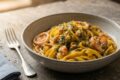 Tagliatelle al ragù di pesce in bianco