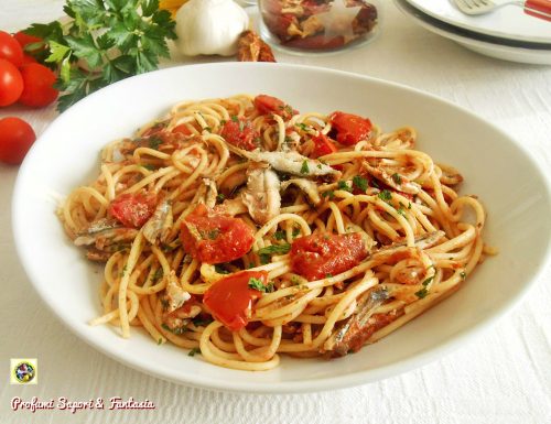 Spaghetti con alici fresche e pomodorini