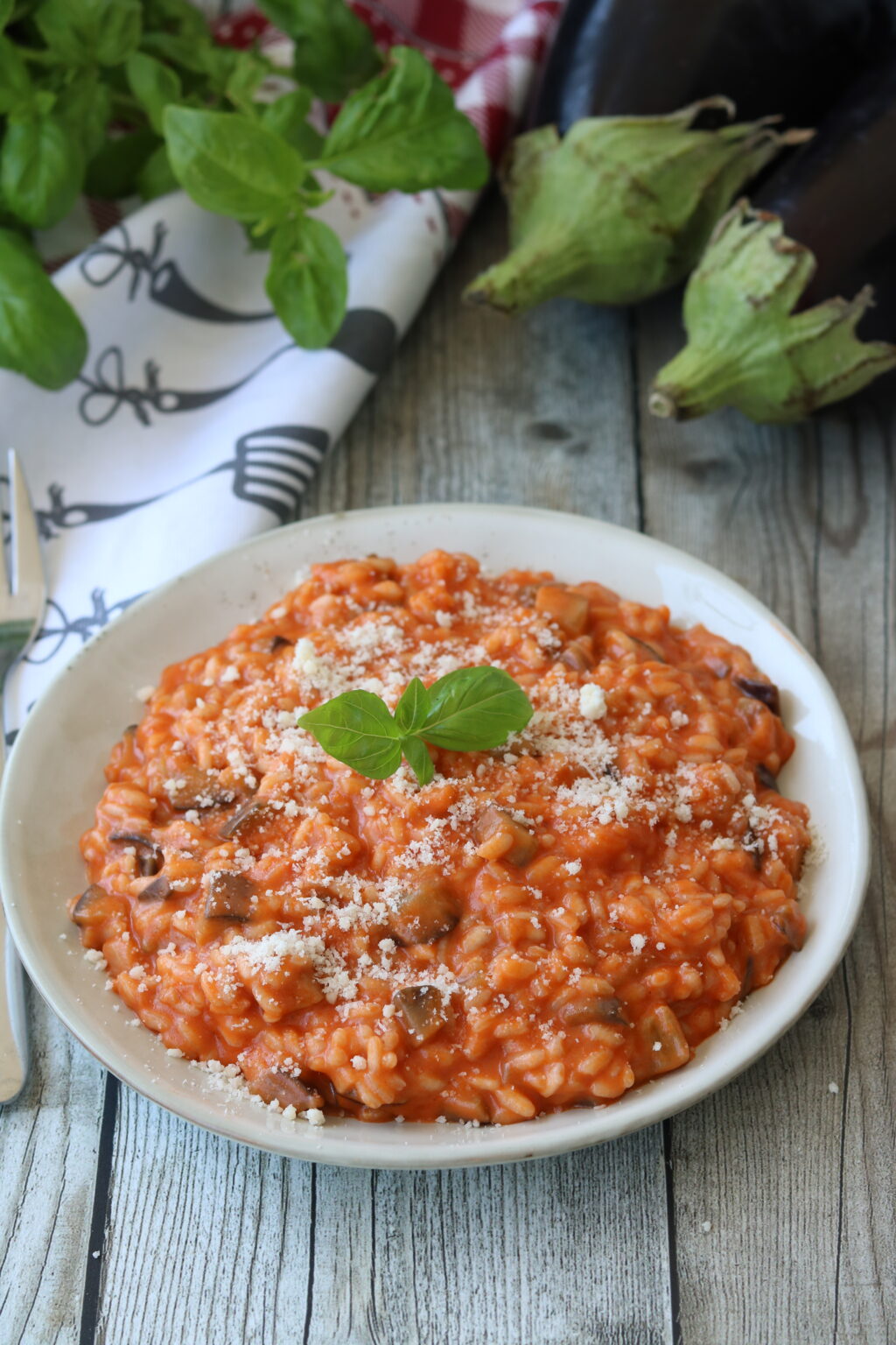 RISOTTO ALLA PARMIGIANA DI MELANZANE con sugo e parmigiano